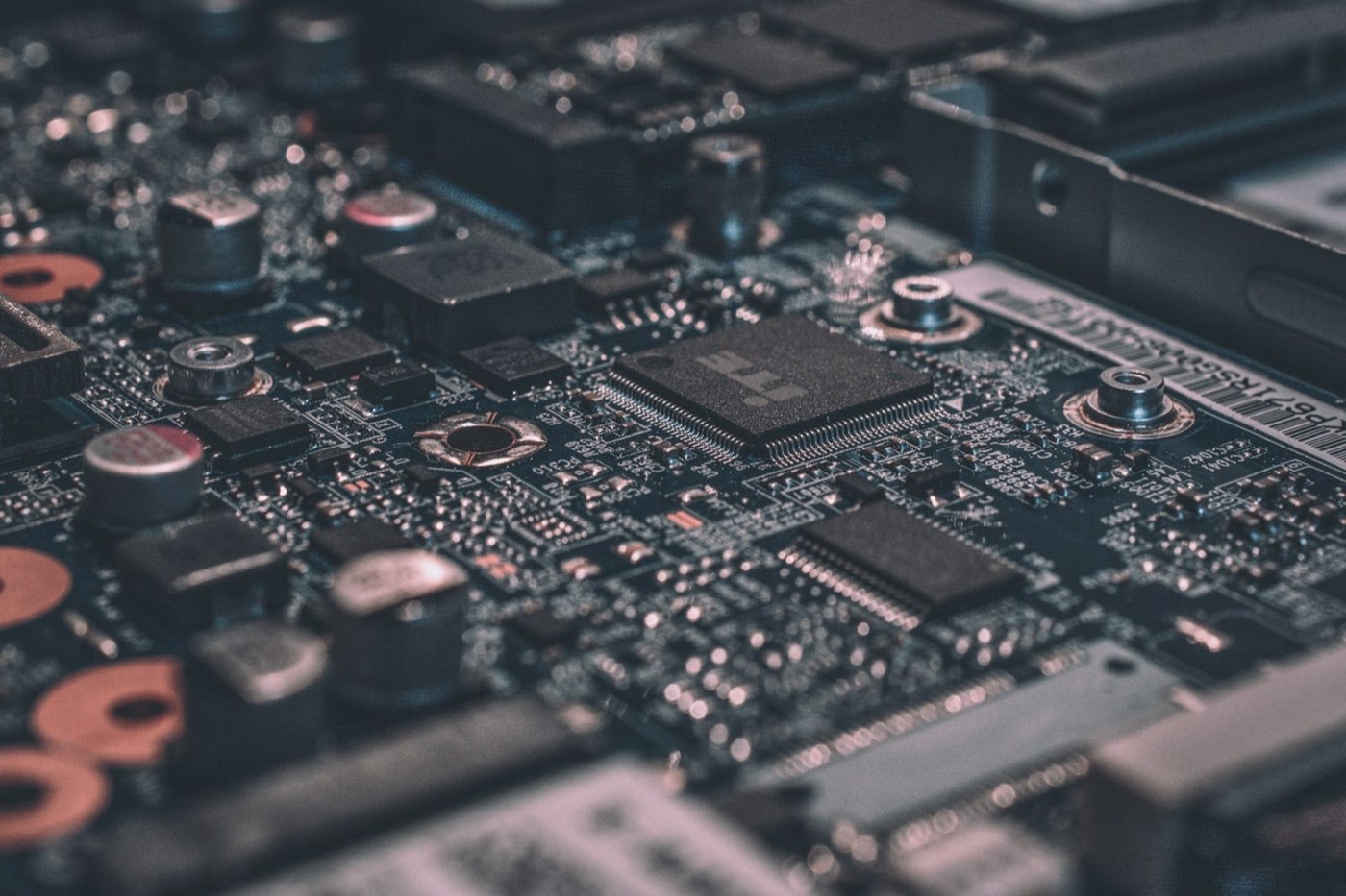 Close-up of circuit-board detail representing the infrastructure under an AI-native platform